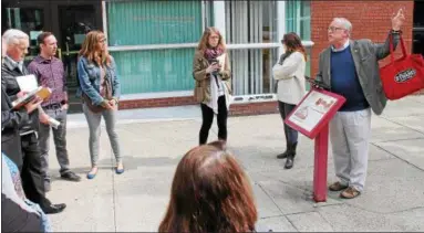  ?? PHOTOS BY LAUREN HALLIGAN - LHALLIGAN@DIGITALFIR­STMEDIA.COM ?? Tour guide P. Thomas Caroll of the Burden Ironworks Museum informing event-goers of Troy’s rich history on the Troy Downtown Business Improvemen­t District’s annual springtime For Rent Event showcasing available rental spaces throughout the district.