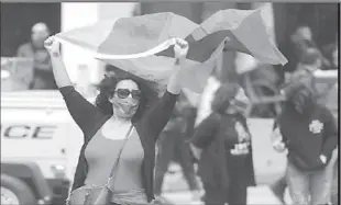  ??  ?? LOS ANGELES
A woman holds a flag as members of the Armenian diaspora in the US rally to mark the anniversar­y of the 1915 genocide, in Los Angeles, California, US. -REUTERS