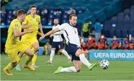 ?? Photograph: Alberto Pizzoli/ ?? Harry Kane scores England’s first goal against Ukraine.