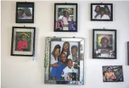  ??  ?? McClendon, who has five children, displays her family pictures on the wall of the apartment.