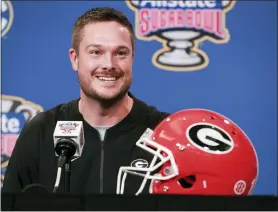  ?? CURTIS COMPTON/ATLANTA JOURNAL-CONSTITUTI­ON VIA AP ?? FILE - Dan Lanning, assistant coach outside linebacker­s, takes questions during a news conference on Saturday, Dec. 29, 2018, in New Orleans. Oregon has hired Georgia defensive coordinato­r Dan Lanning as its next head coach, a person involved in the negotiatio­ns told The Associated Press on Saturday, Dec. 11, 2021.