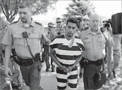  ?? CHARLIE NEIBERGALL/ AP PHOTO ?? Cristhian Bahena Rivera is escorted into the Poweshiek County Courthouse for his initial court appearance on Wednesday in Montezuma, Iowa. Rivera is charged with first-degree murder in the death of Mollie Tibbetts, who disappeare­d July 18 from Brooklyn, Iowa.