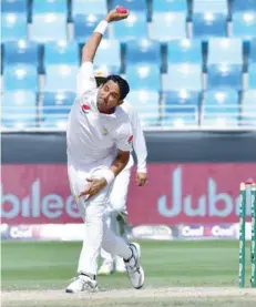  ?? — AFP ?? Pakistan’s Mohammad Abbas bowls during the fifth day of play of the first Test against Australia at the Dubai Internatio­nal Stadium in Dubai.