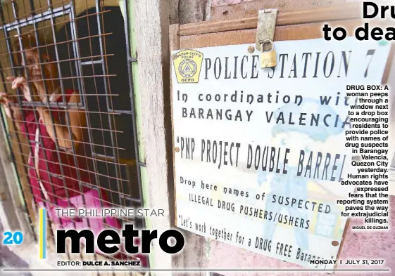  ?? MIGUEL DE GUZMAN ?? DRUG BOX: A woman peeps through a window next to a drop box encouragin­g residents to provide police with names of drug suspects in Barangay Valencia, Quezon City yesterday. Human rights advocates have expressed fears that the reporting system paves the...