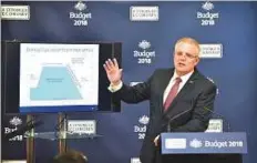  ?? Bloomberg ?? ■ Scott Morrison, Australia’s treasurer, announced modest tax cuts and more support for the elderly in a budget aimed at boosting the government’s flagging poll ratings.