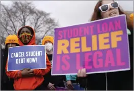  ?? PATRICK SEMANSKY — THE ASSOCIATED PRESS ?? Student debt relief advocates gather outside the Supreme Court on Capitol Hill in Washington on Tuesday as the court hears arguments over President Joe Biden's student debt relief plan.