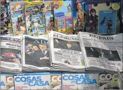  ?? Picture: AFP ?? HEADLINE GRABBER: A picture taken yesterday shows front pages with the new French President Emmanuel Macron on Spanish national newspapers, El Mundo, ABC, El Pais and La Razon in Madrid. Macron was elected French president on Sunday