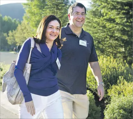  ?? Julie Jacobson Associated Press ?? FACEBOOK COO Sheryl Sandberg and her husband, David Goldberg, in Sun Valley, Idaho, in 2011. Goldberg died suddenly in 2015.