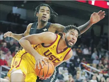  ?? Photograph­s by Gina Ferazzi Los Angeles Times ?? ISAIAH MOBLEY scored a team-high 21 points with 12 rebounds against Jordan Roberts and the Beach.