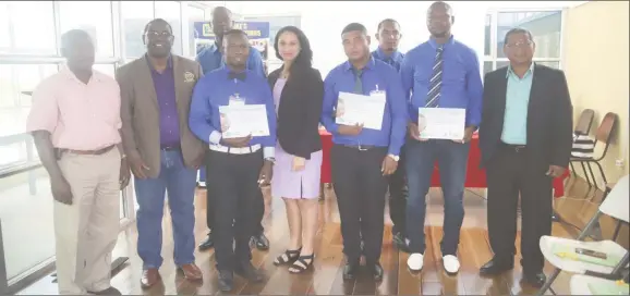  ??  ?? The managing directors of the two companies, Raymond Tawjoeram (left), Adrian Clarke (second from left), along with five of the graduates and one of the tutors, Sabrina Van Dyke (centre). (photo by Terrence Thompson)