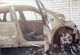  ??  ?? The Renault used by the shooters was found torched nearby.