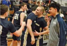  ?? OWEN MCCUE - MEDIANEWS GROUP ?? Spring-Ford’s Ryan Hagan, center, celebrates with teammates after defeating Cheltenham in a District 1-6A playback game Tuesday.