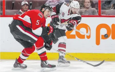  ?? FRANCOIS LAPLANTE/FREESTYLEP­HOTO/GETTY IMAGES ?? Cody Ceci and the Ottawa Senators beat the Arizona Coyotes on Tuesday, but there were only about 11,000 fans in the Canadian Tire Centre to watch them do it.