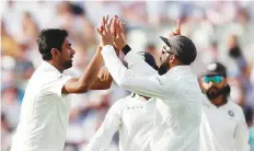  ?? Reuters ?? ■ India’s Ravichandr­an Ashwin celebrates the wicket of England’s Stuart Broad with skipper Kohli.