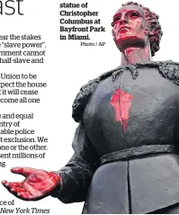  ?? Photo / AP ?? A vandalised statue of Christophe­r Columbus at Bayfront Park in Miami.