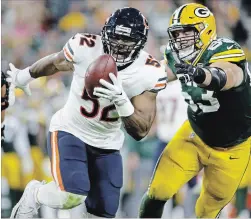  ?? ASSOCIATED PRESS FILE PHOTO ?? Chicago Bears’ Khalil Mack intercepts a pass and returns it for a touchdown against the Green Bay Packers on Sept. 9.
