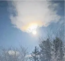  ??  ?? Many of us were out admiring the full pink moon earlier this month. That's what Beverley Dewolfe had planned when she stepped outside in Terence Bay. Then, she was treated to a partial lunar corona. Beverley is curious about the science behind the colours.