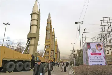  ?? (AFP) ?? This file photo shows Iranians visiting a weaponry and military equipment exhibition in the capital Tehran on February 2, 2019