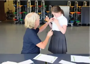  ??  ?? ●●A Norden Primary pupil receives a sticker after her flu vaccinatio­n