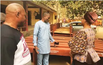  ??  ?? Centre Pastor, CCIC, Ojokoro, Ayodele during the donation of chairs and tables to Ijaiye Ojokoro High School to commemorat­e the church’s 30th anniversar­y