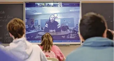  ?? NATIONAL CONSTITUTI­ON CENTER / JTWO FILMS ?? Grace Narkum, a student from Hubbard High School in Hubbard, Ohio, and her classmates participat­e in a National Constituti­on Center Peer-to-peer Exchange with students from Radnor High School in Wayne, Pa., in March 2019.
