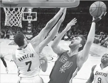  ?? Wally Skalij Los Angeles Times ?? THE SPURS’ Pau Gasol tries to get a shot off amid stiff defensive pressure from the Lakers’ Larry Nance Jr. Gasol was a key member of the Lakers when they won championsh­ips in 2009 and 2010.
