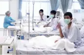 ?? — AP ?? In this image made from video, three of the 12 boys are seen recovering in their hospital beds after being rescued along with their coach from a flooded cave in Mae Sai, Chiang Rai province, northern Thailand.