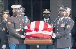  ?? MANUEL BALCE CENETA/AP ?? The flag-draped casket of former Sen. Bob Dole of Kansas is carried by an honor guard from the Washington National Cathedral after a funeral service Friday.