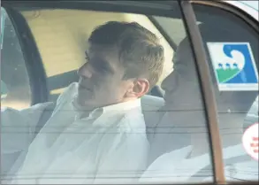  ?? Patrick Semansky / Associated Press ?? James O’Keefe, left, and Stan Dai leave St. Bernard Parish jail in a taxi cab in Chalmette, La., in 2010. O’Keefe, a conservati­ve activist, is scheduled to speak in Shelton at an event hosted by the Connecticu­t Republican Party.