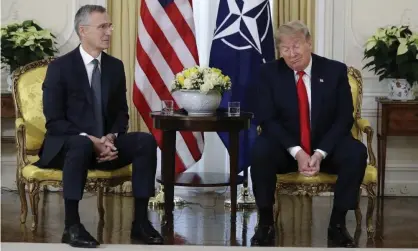  ??  ?? Donald Trump grimaces during a meeting with Nato’s secretary general, Jens Stoltenber­g, in central London. Photograph: Evan Vucci/AP