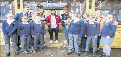  ?? 20809713 ?? Commonweal­th Games medallist Courtney Tulloch with pupils and staff at Palace Wood Primary School who can now enjoy an outdoor classroom