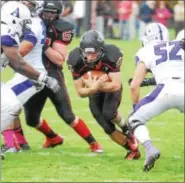  ??  ?? Wesleyan senior running back Kyle Gibson finds some running room against Amherst on Saturday.