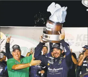 ?? Brian Lawdermilk / TNS ?? Martin Truex Jr. celebrates in Victory Lane after winning the Monster Energy NASCAR Cup Series Quaker State 400 at Kentucky Speedway in 2018 in Sparta, Ky.