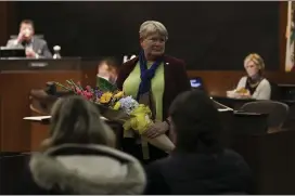  ??  ?? Ann Schwab is recognized for her service to Chico during a City Council meeting on Tuesday.