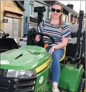  ?? Photos by Michelle Cooper Galvin ?? Eilis Lyne on her tractor mower participat­ing in the Lawnmower Race in aid of Recovery Haven in Killorglin on Friday.