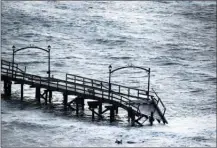  ?? The Canadian Press ?? White Rock’s pier was severely damaged during an intense windstorm on Thursday.