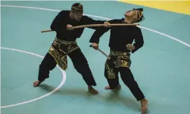  ?? Photograph: Bay Ismoyo/AFP/Getty Images ?? Pencak silat is the umbrella term used for the many forms of ancient Indonesian martial arts.