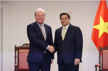  ?? VNA/VNS Photo ?? Prime Minister Phạm Minh Chính meets Director-general of the World Bank Axel Van Trotsenbur­g in the US on Wednesday (local time).