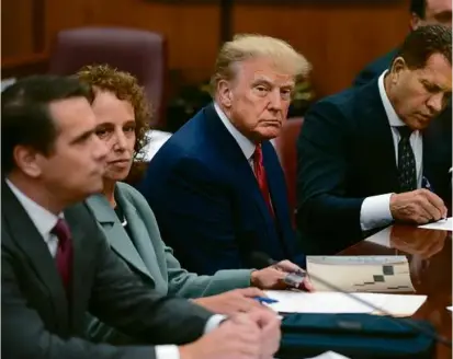  ?? SETH WENIG/ASSOCIATED PRESS/POOL ?? Former president Donald Trump sat at the defense table with his legal team in a Manhattan court on April 4 in New York.