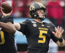  ?? (Arkansas Democrat-Gazette file photo) ?? Taylor Powell came off the bench to lead Missouri to a 24-14 victory over Arkansas in 2019 at War Memorial Stadium in Little Rock. The former Fayettevil­le star announced in December that he was transferri­ng to Troy to play his final two years in college.