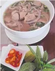  ??  ?? The best pho in town (above) and delicious laksa (left) and Non La Vietnamese restaurant