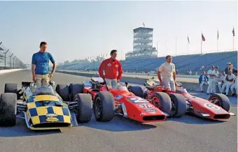  ?? AP ?? Al Unser (left) poses with Mario Andretti (center) and A.J. Foyt, who also won the Indianapol­is 500 four times, in 1969. The Unser-Andretti rivalry is one of the most famous in the long history of the event.