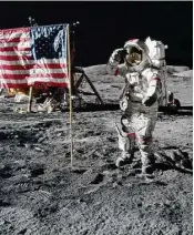  ?? Jack Schmitt / NASA / Gravitas Ventures ?? Astronaut Gene Cernan salutes the U.S. flag planted on the moon during the Apollo 17 mission in 1972.