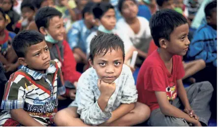  ??  ?? Young victims: Children affected by the earthquake and tsunami taking refuge at a temporary shelter.