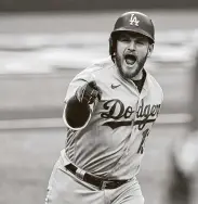  ?? Eric Gay / Associated Press ?? The Dodgers’ Max Muncy fired up his teammates by hitting a grand slam to cap an 11-run first inning.