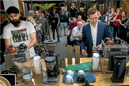  ?? WARWICK SMITH/STUFF ?? James Mckenzie, right, from Arrosta Coffee in Palmerston North, on his way to victory in the final against Hawke’s Bay barista Ryan Huthnance. Mckenzie won the throwdown with his tulip design, left.