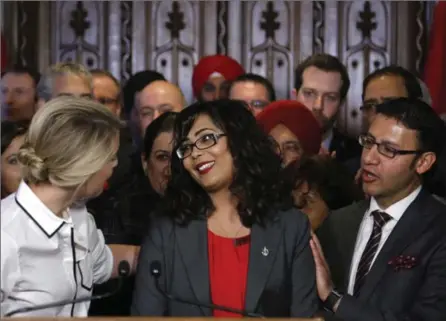  ?? PATRICK DOYLE, THE CANADIAN PRESS FILE PHOTO ?? Member of Parliament Iqra Khalid is congratula­ted by colleagues as she makes an announceme­nt about an anti-Islamophob­ia motion on Parliament Hill in Ottawa on Wednesday, February 15, 2017.