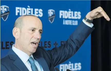  ?? PAUL CHIASSON/THE CANADIAN PRESS ?? “I believe this team should be selling out every game,” MLS commission­er Don Garber told a news conference Tuesday at the Montreal Impact’s Centre Nutrilait practice facility. “We have to figure out what we need to do to get that to happen.”