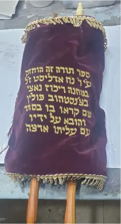  ?? (Courtesy) ?? THE TORAH SCROLL that was smuggled into the HASAG forced labor camp in Czestochow­a, Poland.