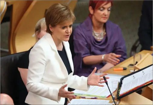  ??  ?? NICOLA STURGEON: Found herself under fire over hospital waiting times and declining standards in schools during FMQs at Holyrood yesterday. Picture: Gordon Terris